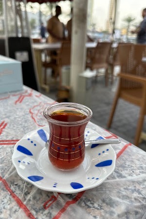 Traditional karak tea served on the outdoor terrace